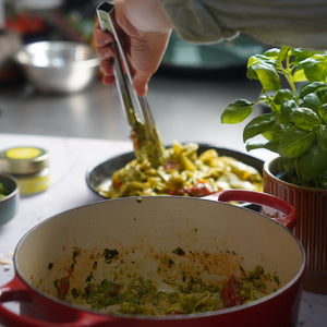 Bella Italia Italian herbs being added to pasta sauce
