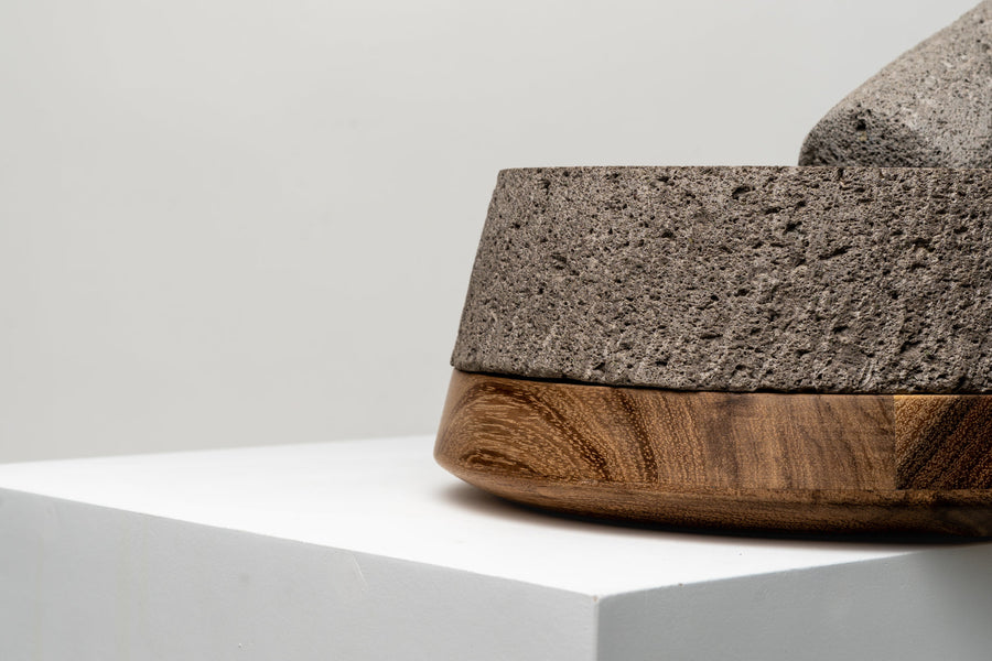 Molcajete styled with fresh ingredients on linen napkin