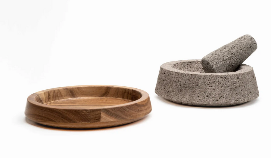 Fresh guacamole being made in a molcajete