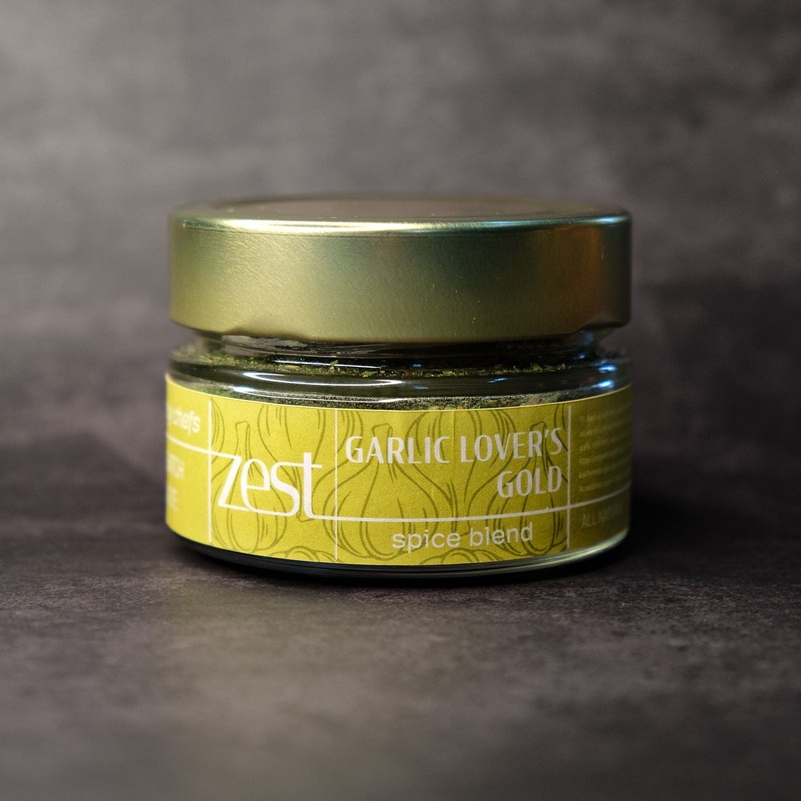 Garlic Lovers' Gold gourmet garlic spice blend in glass jar with ZEST label